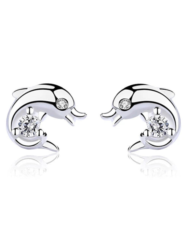 Dolphin-shaped earrings with clear gemstones on a white background