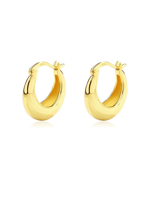 Gold hoop earrings on a white background