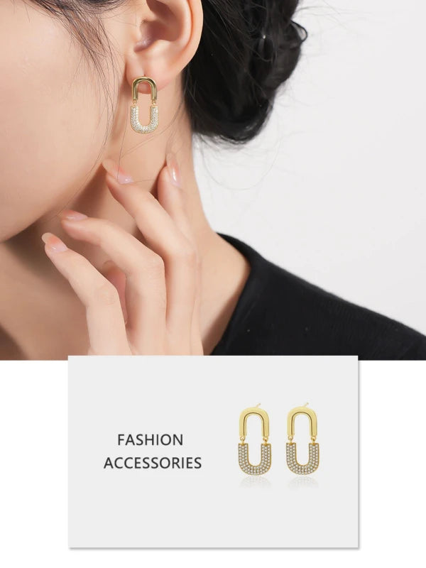 Gold hoop earrings worn by a person with a 'Fashion Accessories' label below.