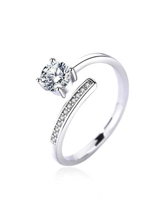 Silver ring with a diamond on a white background