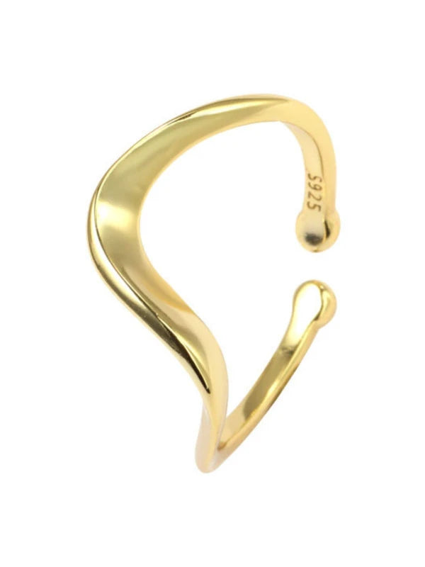 Gold open cuff bracelet on a white background
