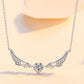 Silver necklace with a heart-shaped pendant on a light background