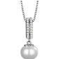 Pearl pendant necklace with silver chain on a white background