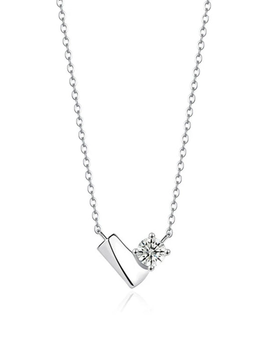 Silver necklace with a diamond pendant on a white background