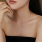 Necklace with a pendant worn by a model against a neutral background