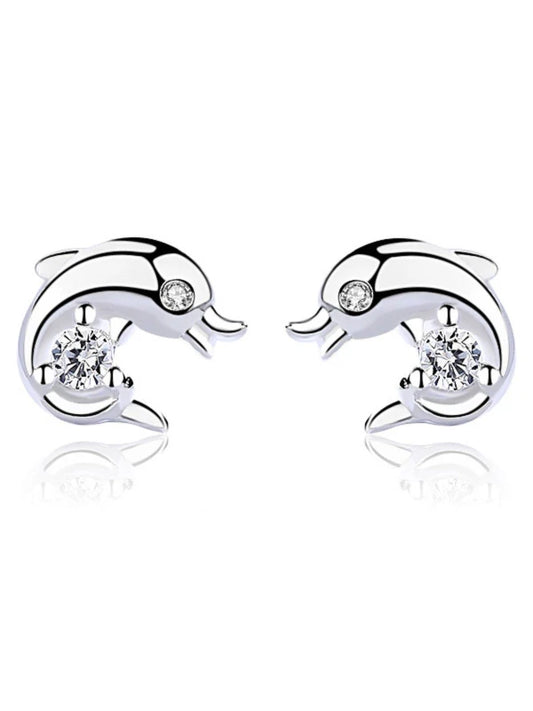 Dolphin-shaped earrings with clear gemstones on a white background