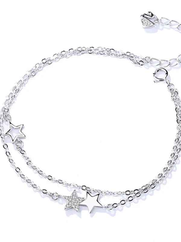 Silver bracelet with star charms on a white background