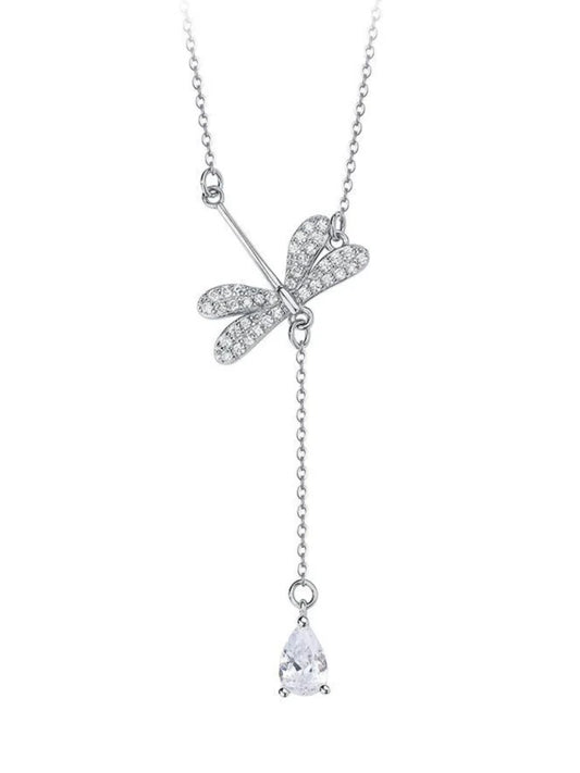 Silver necklace with a dragonfly pendant and teardrop-shaped charm on a white background