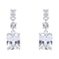 Pair of silver earrings with clear square gemstones on a white background