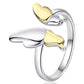 Silver and gold heart-shaped ring on a white background