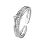 Silver ring with embedded diamonds on a white background