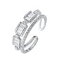 Silver ring with baguette-cut gemstones on a white background