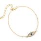 Gold bracelet with a blue eye design on a white background