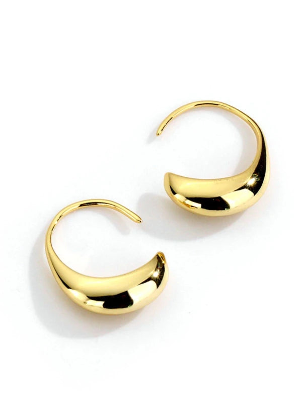 Pair of gold hoop earrings on a white background