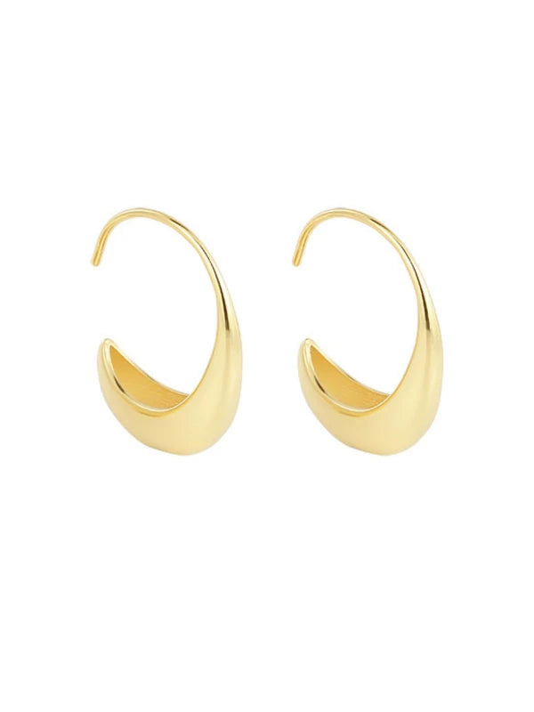 Gold hoop earrings on a white background