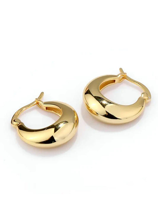 Gold hoop earrings on a white background