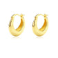 Gold hoop earrings on a white background
