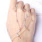 Delicate bracelet with small crystals on a hand against a white background
