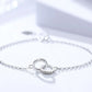 Silver bracelet with heart-shaped clasp on a white background