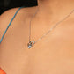 Necklace with a heart-shaped pendant worn by a woman