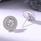 Diamond earrings with pink gemstones on a light background