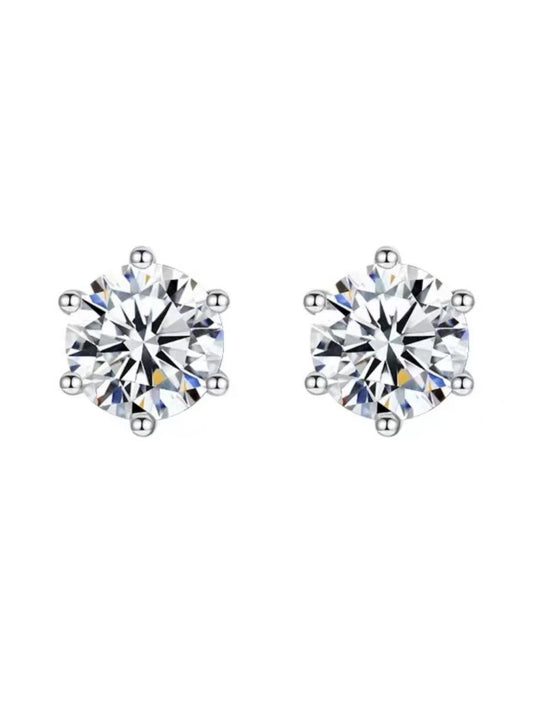 Pair of diamond stud earrings on a white background