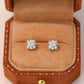 Diamond earrings in a brown jewelry box