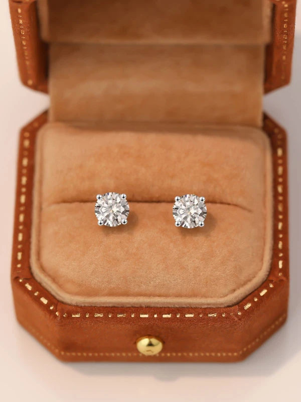 Diamond earrings in a brown jewelry box