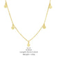 Gold necklace with small round pendants on a white background