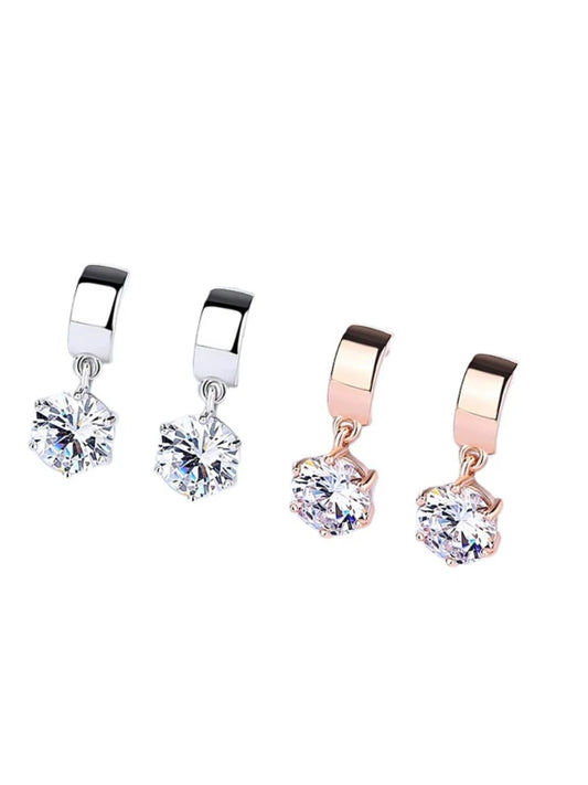 Pair of earrings with clear gemstones on a white background
