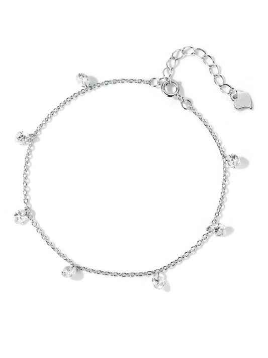 Silver bracelet with heart charms on a white background
