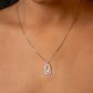 Necklace with a pendant on a person's neck