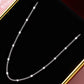 Silver chain necklace on a black background