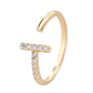 Gold ring with small diamonds on a white background