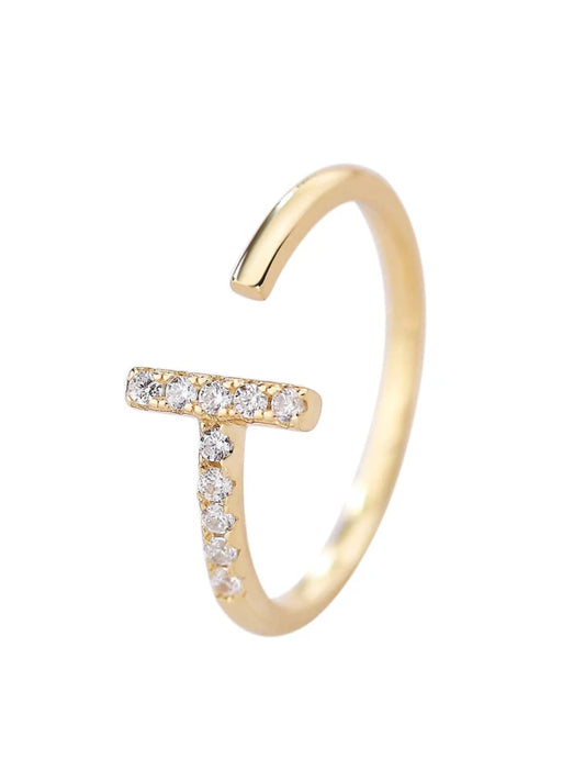 Gold ring with small diamonds on a white background