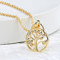Gold necklace with a tree-shaped pendant on a white surface