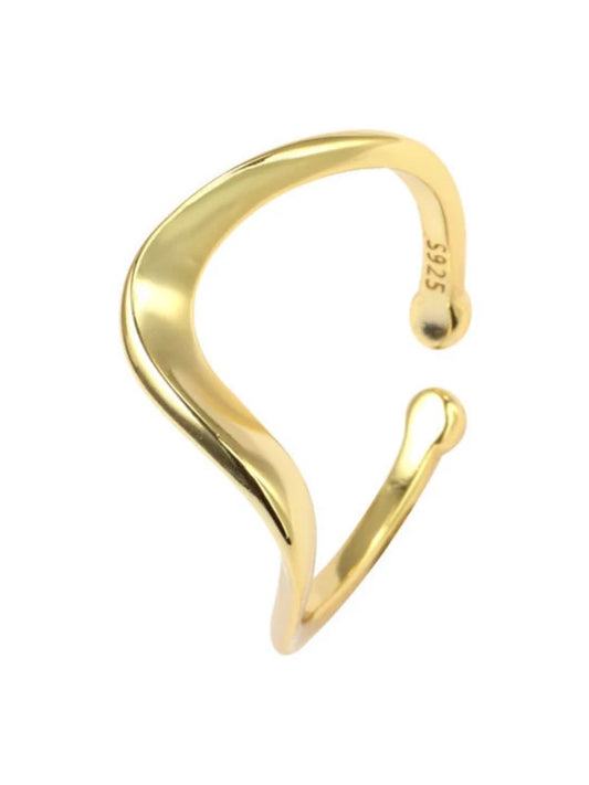 Gold open cuff bracelet on a white background