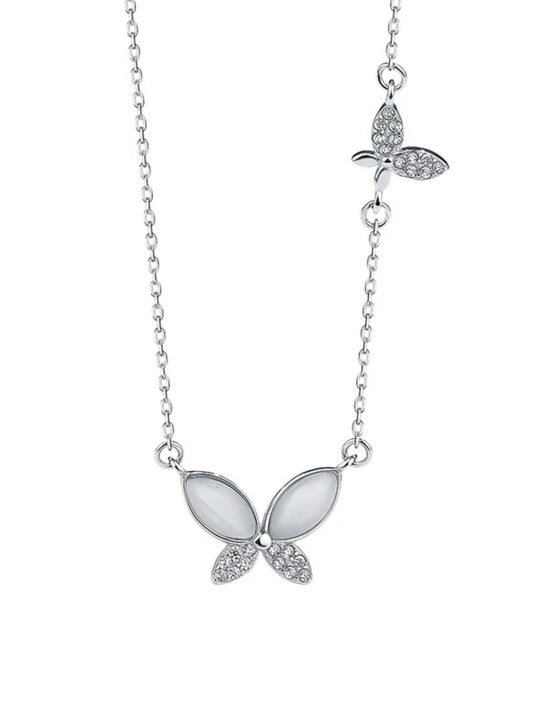 Butterfly necklace with gemstones on a white background